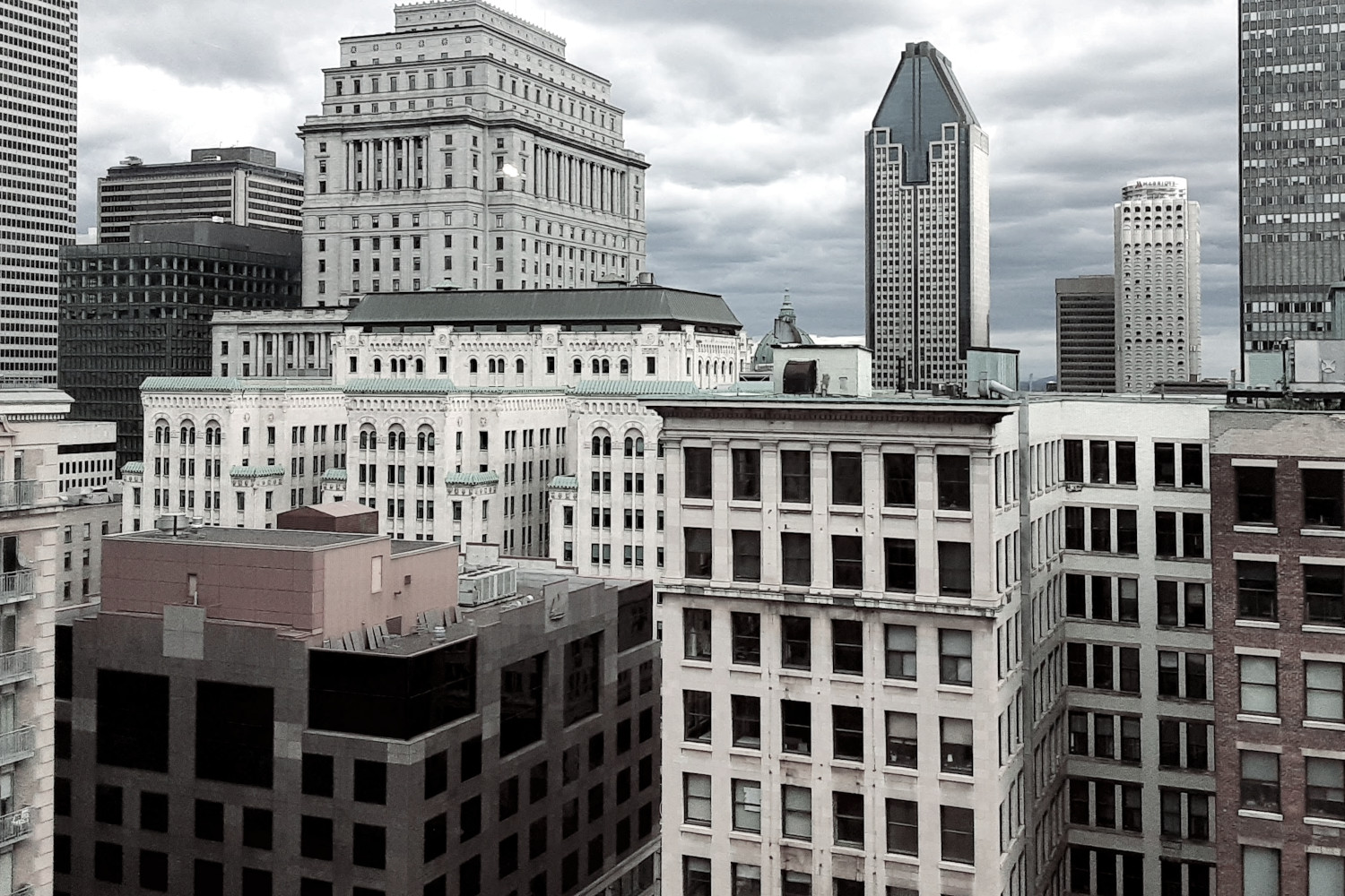 Photo of downtown Montreal with grey clouds in the background